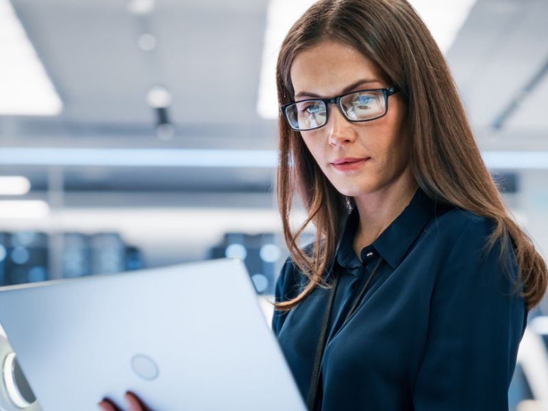 Businesswoman using tablet in modern office